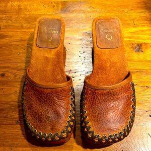 Cool boho low healed slides with hand made wood carved heels with whip stitching